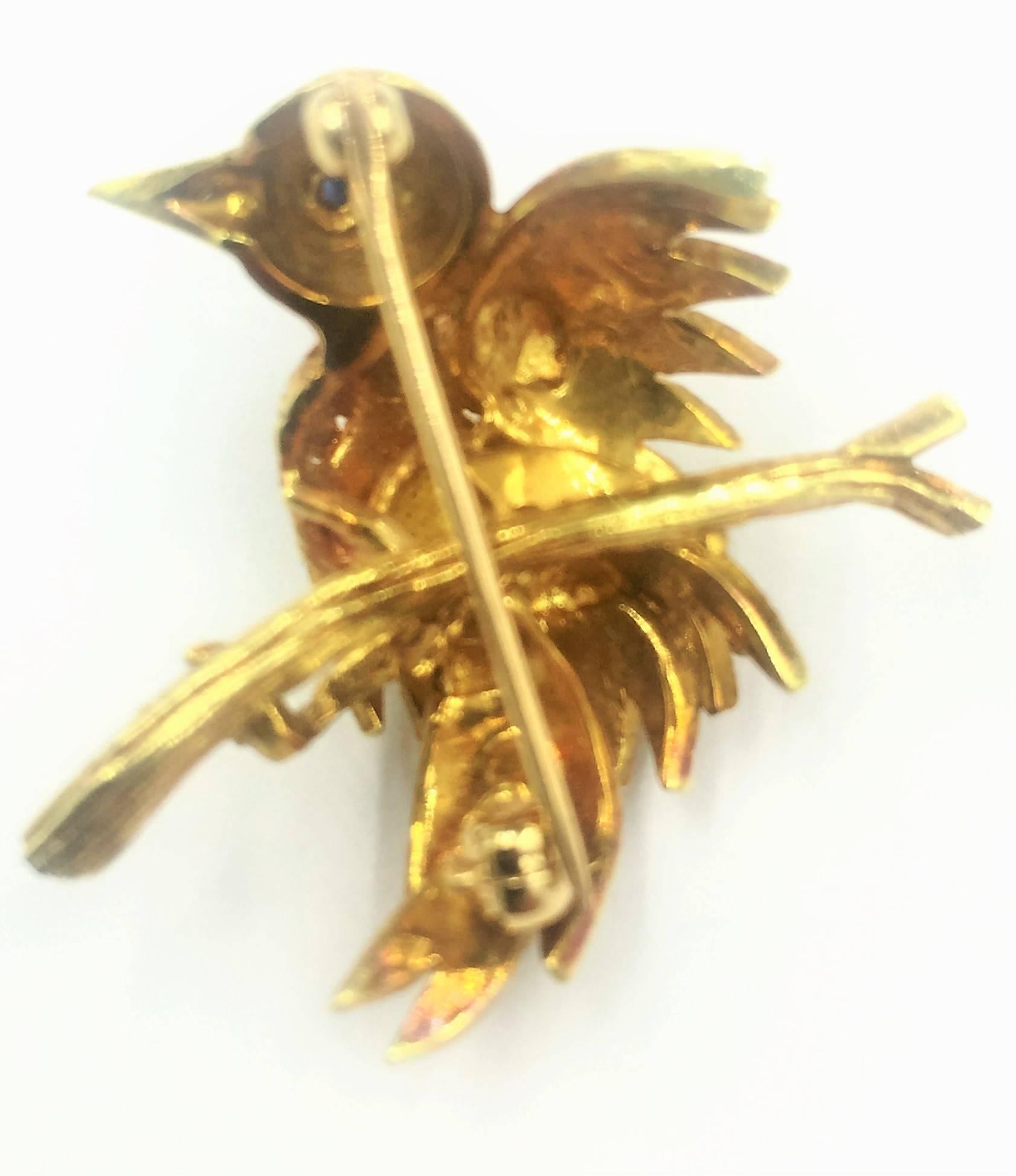 Lovable in every way this Vintage 18kt Gold and Sapphire Bird on Perch Pin Brooch features a .05 carat blue sapphire as the eye and a painstakingly textured finish for the feathers and perch. The perfect gift for the bird lover or Tiffany & Co.
