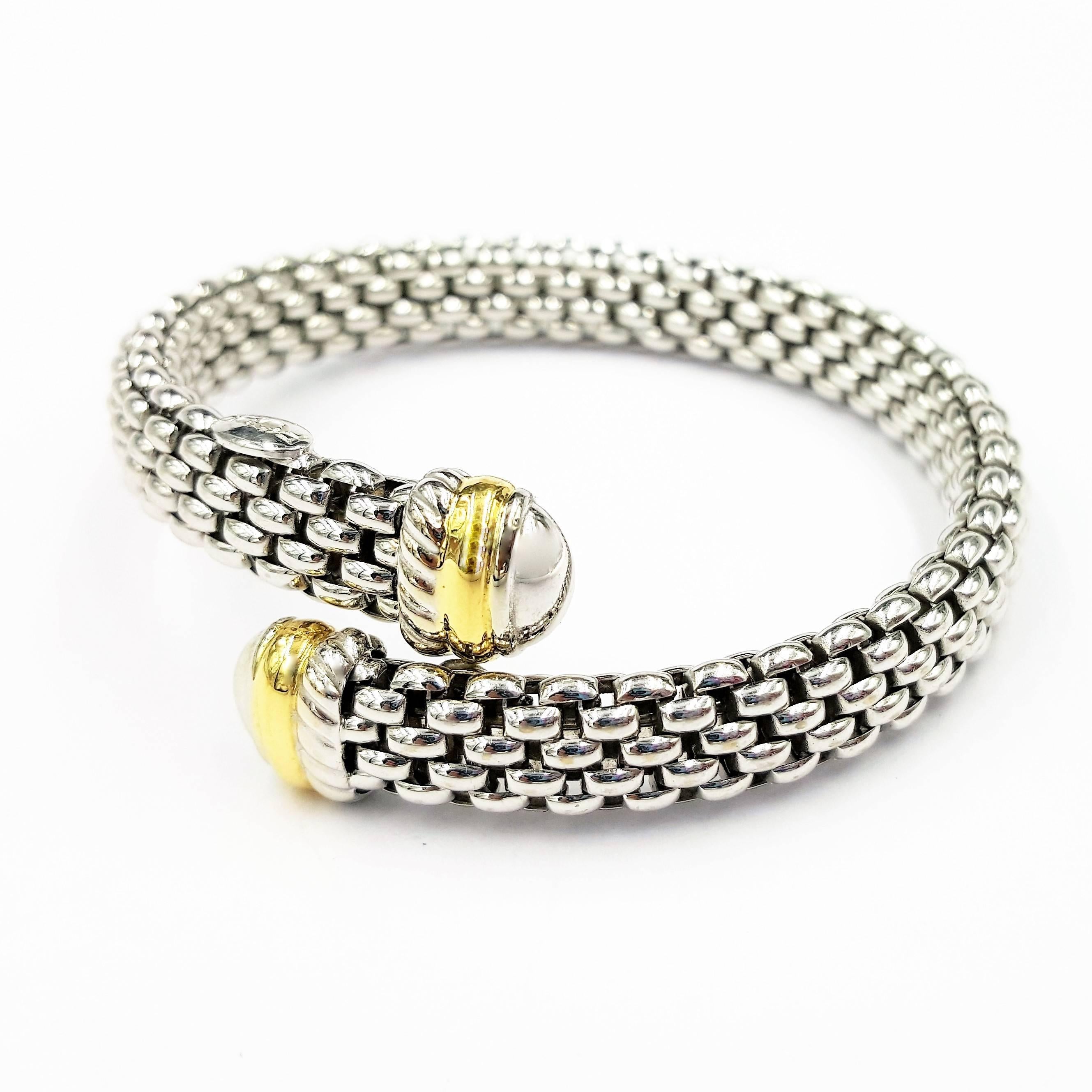 This Signed FOPE Italian Designer 18kt White and Yellow Gold Flexible Bracelet is truly stunning and makes a brilliant addition to any outfit. The bracelet itself fill fit a wide variety of wrist sizes as it is flexible and is uniquely designed by