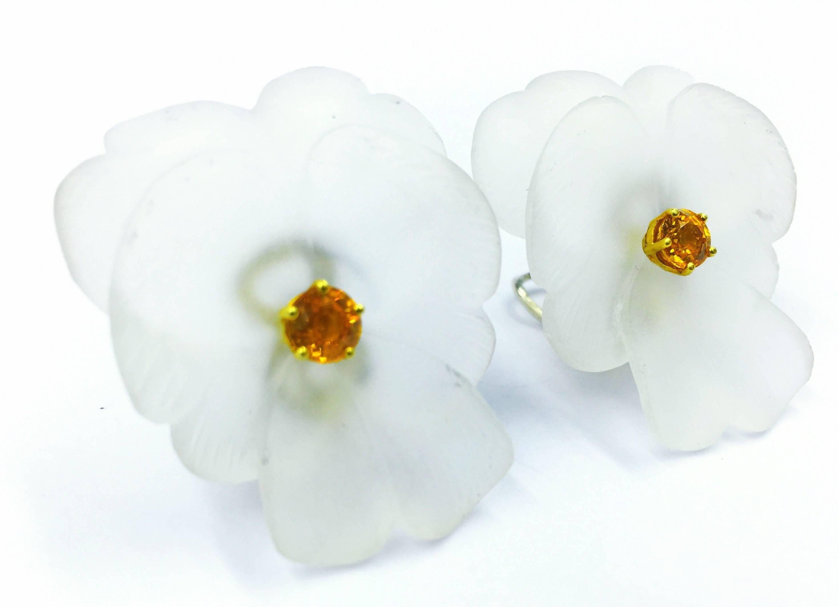 These rare and beautiful earrings are an example of Paloma Picasso's artistic genius during perhaps her most active period designing for Tiffany & Co. Two Hand Carved Rock Crystal Pansy Flowers with 2.00 carats of yellow sapphires set with 18kt