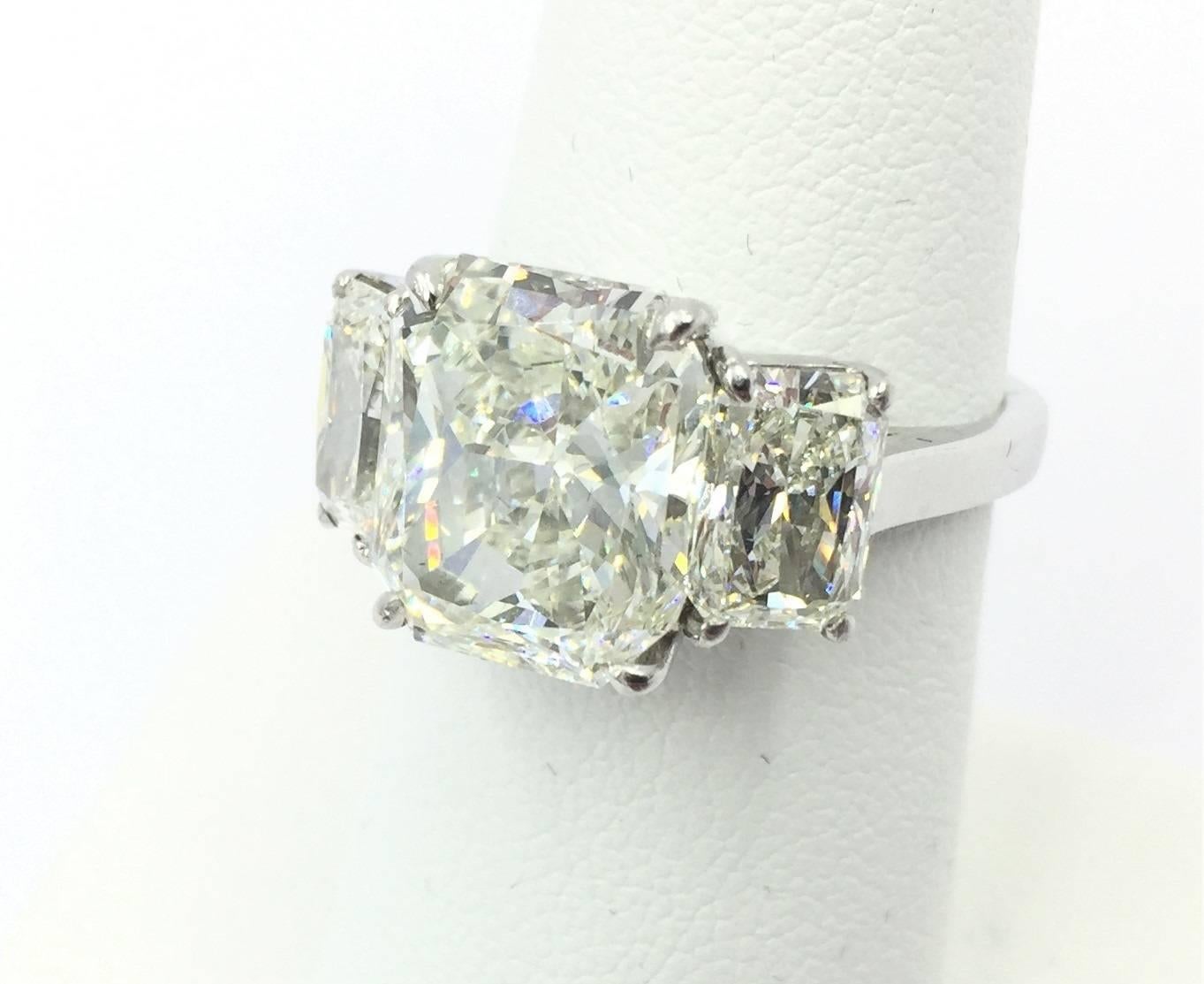 This gorgeous Chopard engagement ring features all GIA certified stones with a  5.00 carat center radiant brilliant cut diamond graded J in color and VS2 in clarity. The center stone has no fluorescence, has a grade of good polish, and good symmetry