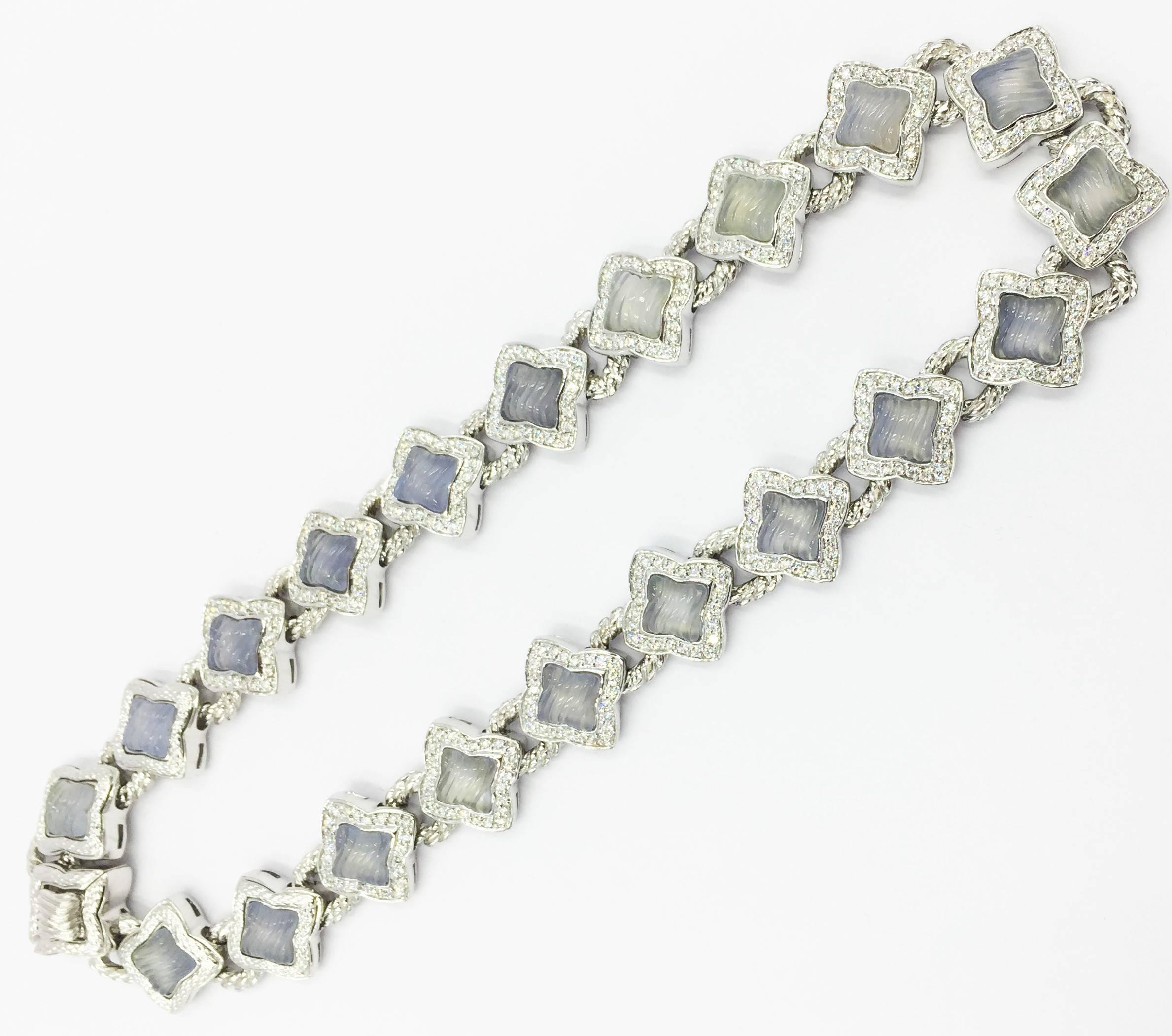 This Rare Signed David Yurman Chalcedony and 7 carats of Diamonds Quatrefoil Necklace is a one of a kind find and a must have for the rare David Yurman Collector. It measures 15 inches in length and weighs 121.3grams.

This necklace has been