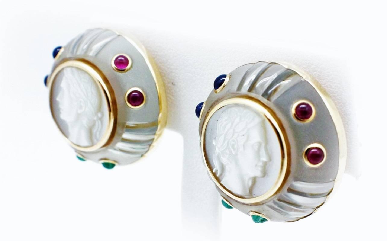 This signed Trianon gorgeous mother of pearl intaglio style cameos set on top of white rock crystal. The earrings are surrounded by custom carved and differing textures which shows the extreme detail Trianon put into this piece, Then to top it off