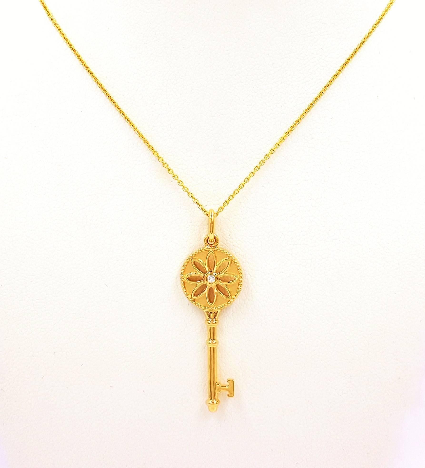 Signed Tiffany & Co. Diamond Featured in A Gold Daisy Key Pendant 1