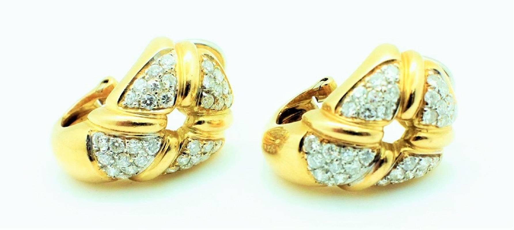 These spectacular signed Chaumet Paris Clip On Earrings feature 1.50 carats of VS clarity G color white round brilliant cut diamonds set in a gorgeous 18kt yellow gold. The earrings are highly desirable and contain the vintage French Hallmarks on