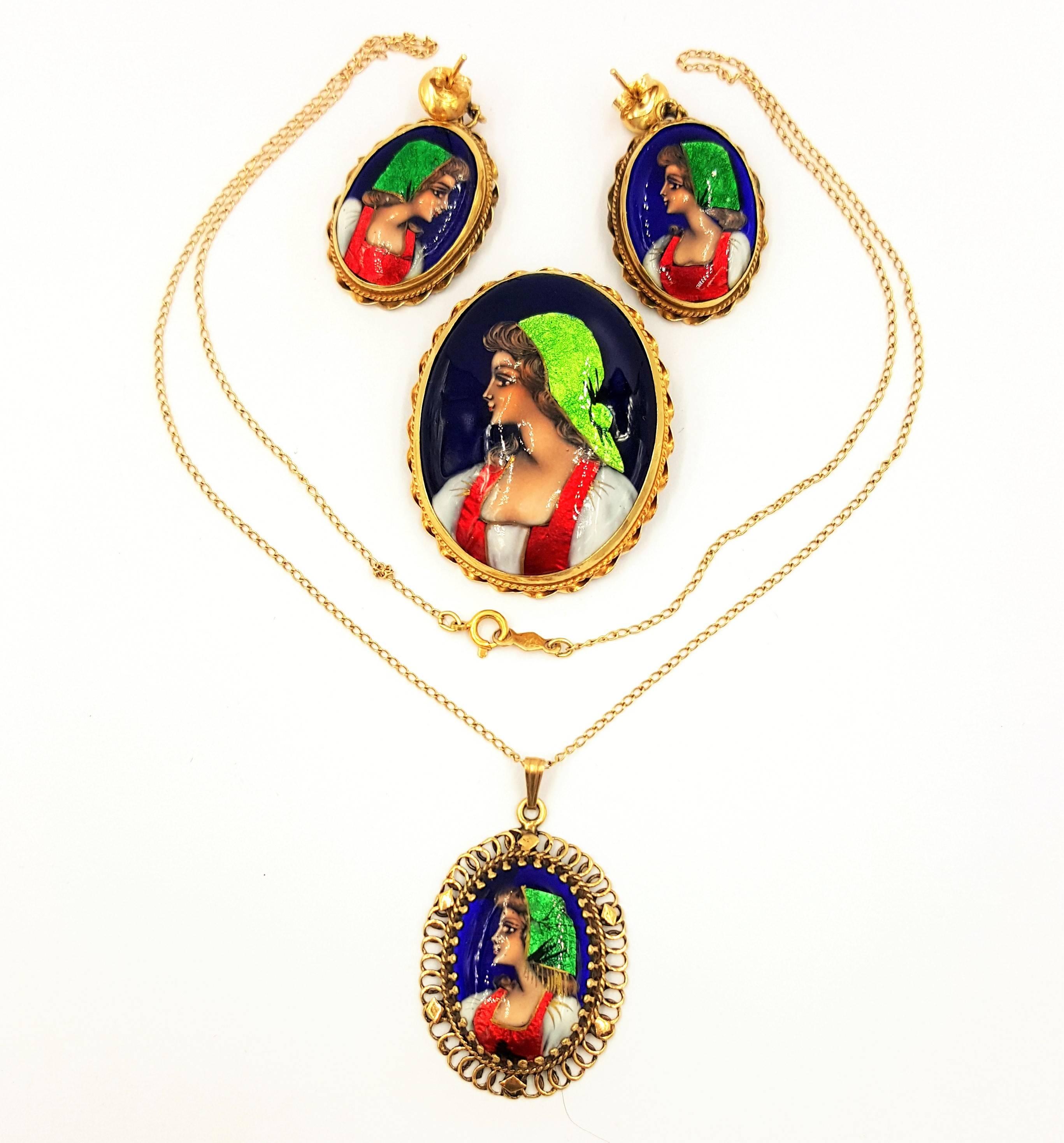 This gorgeous Circa 1950's Revival Cameo Hand Painted Mini Portrait Suite in Perfect Condition Made in France includes one brooch in perfectly new condition, with matching necklace, and earrings. This is an absolutely stunning set and carries a