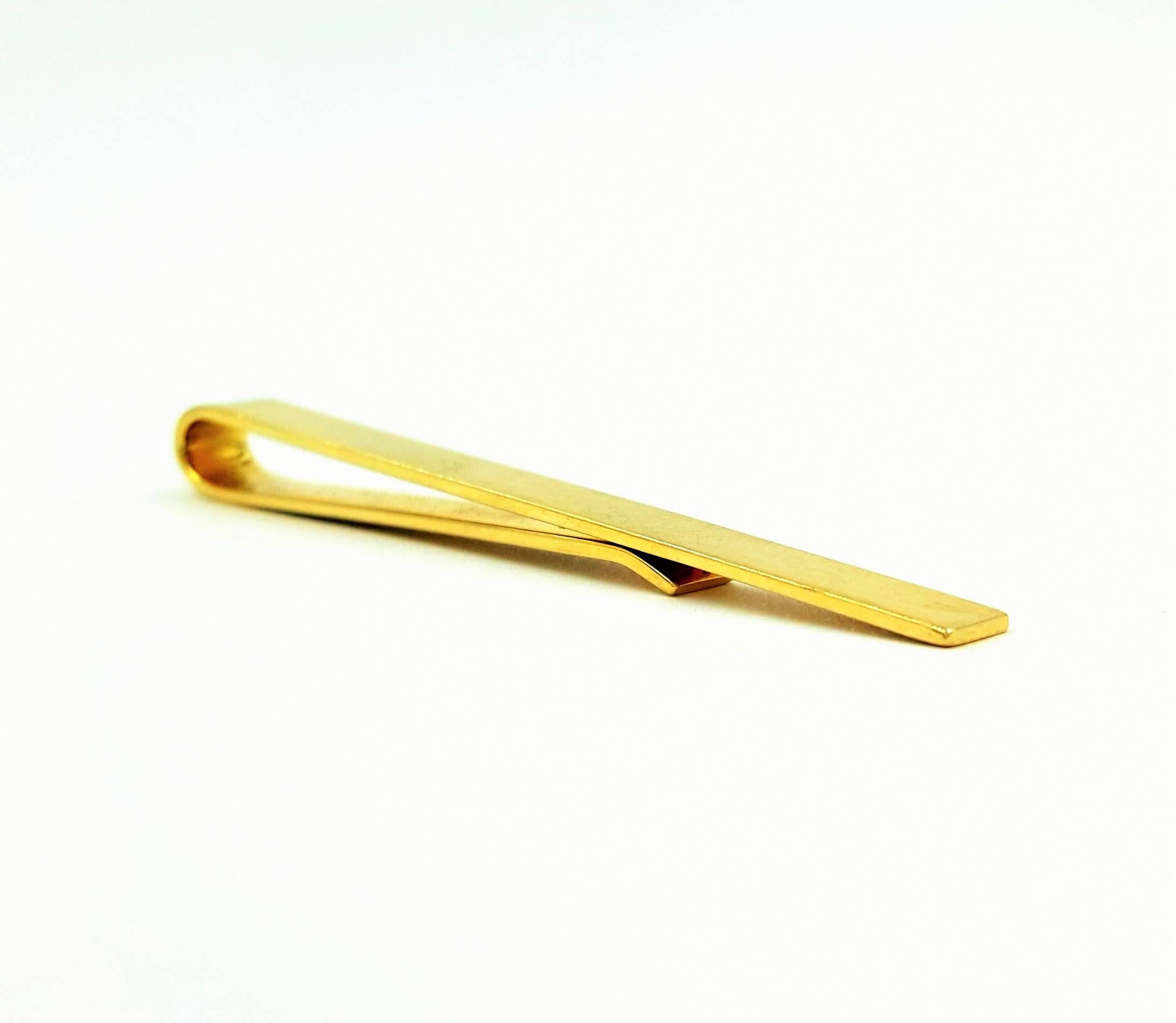 This sharp and classic Tiffany & Co. clip can be used either as your billfold or your tie clip or both! This piece weighs 5 grams and is 2 inches in length by .25 inches in width and caries correct 