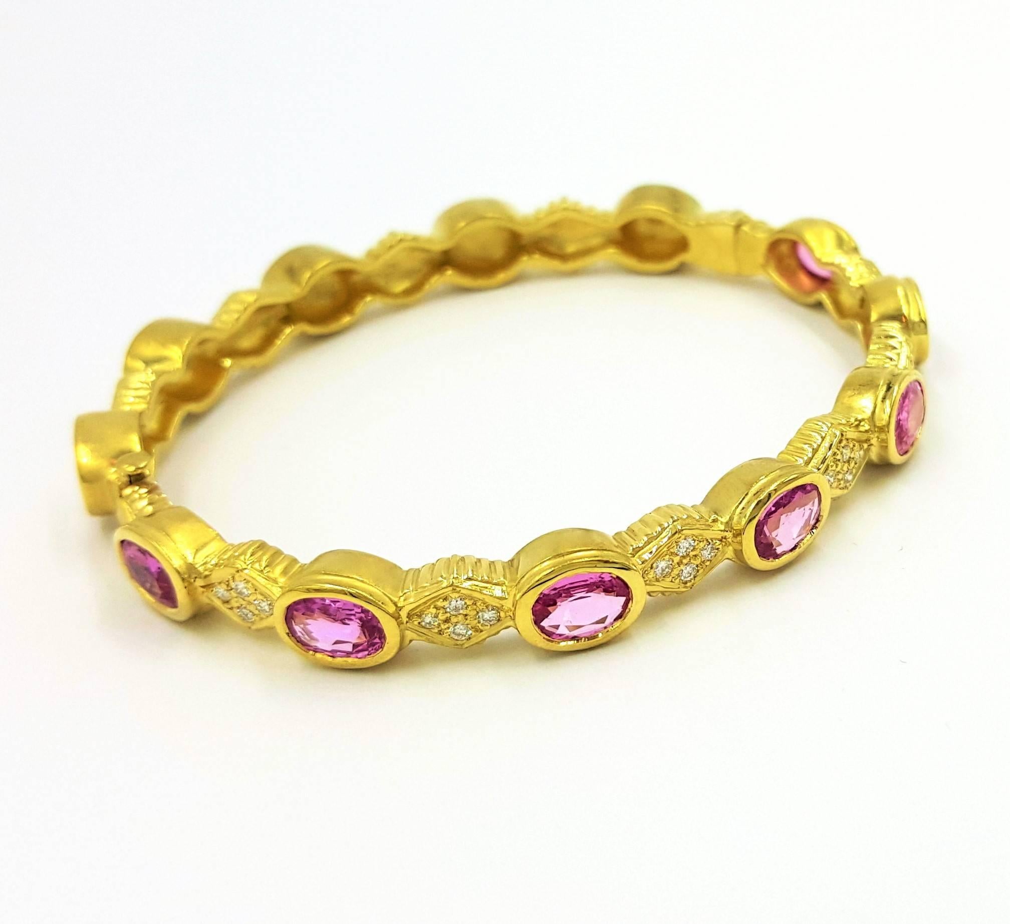 This Doris Panos Signed Hinged Bangle Bracelet Features 7 Carats Of Natural Deep Purplish Pink Sapphires and .25 Carat of VS Clarity, G White Color, Round Brilliant Diamonds Set in 35 grams of 18KT Solid Gold And is Absolutely Fabulous! A truly