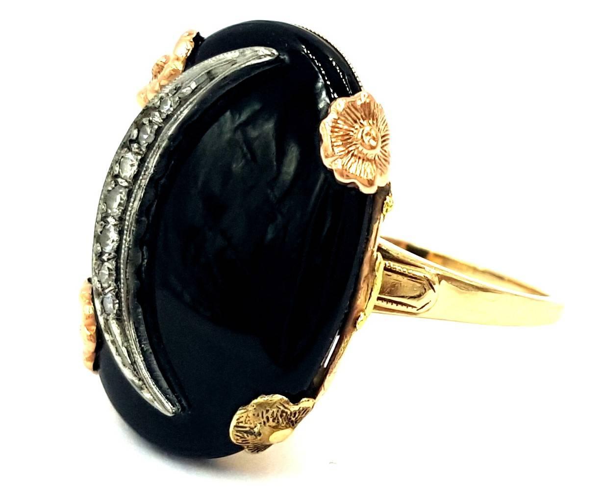 This unique and one of a kind 1950's Retro Period 14kt Gold ring features an onyx black background symbolizing the dark night sky. With a specially hand crafted piece of white gold with .25 carats of single cut diamonds    that are VS in clarity and