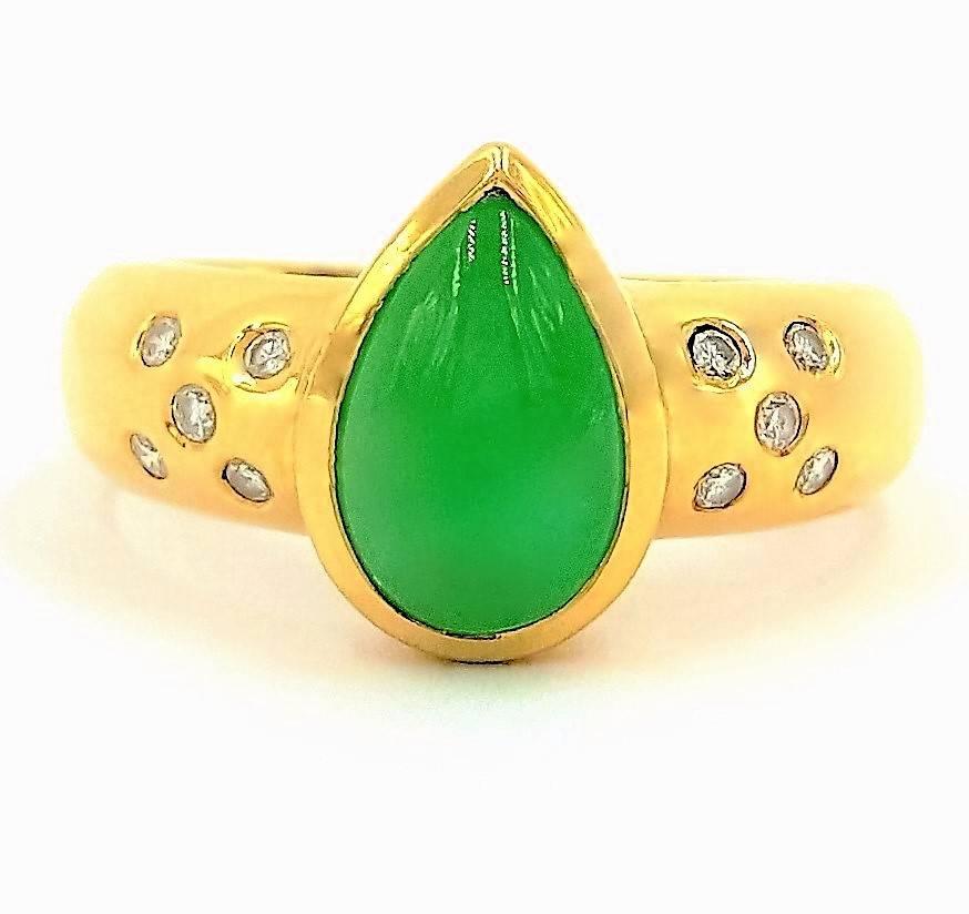 This ring is absolutely spectacular featuring a natural untreated specimen of the most sough after jade in the world. This jade is not dyed or in any other way altered from its natural state. This jade is an intense vivid emerald green refracting