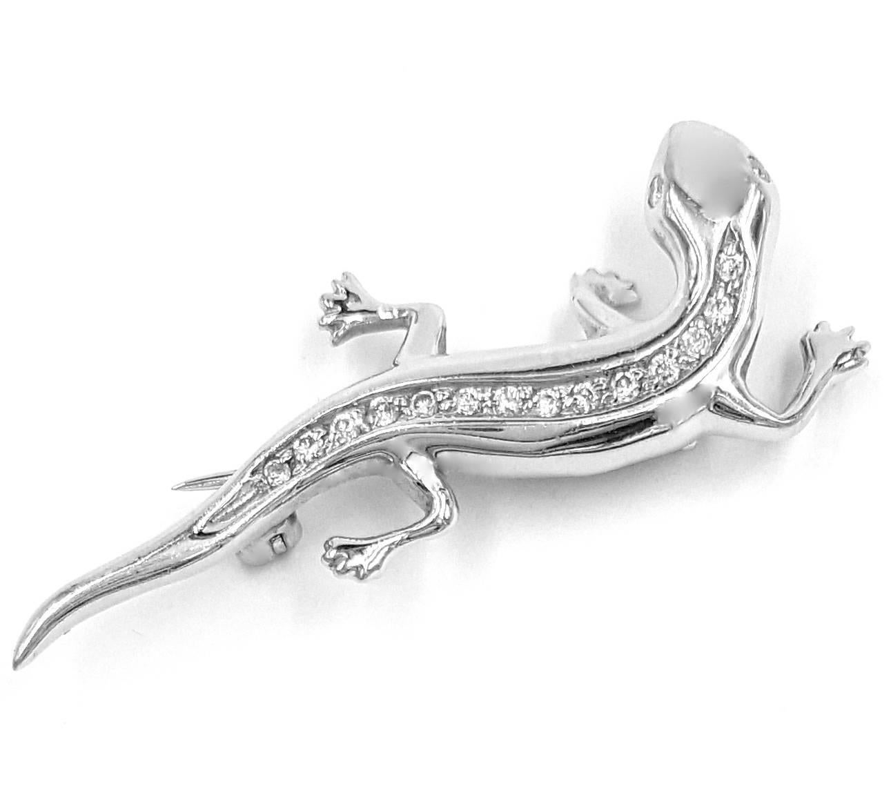 This is such a cute pin. It is crafted from 14K White Gold. This little creature features 16, 1.5 mm - 2.3 mm single cut diamonds bead set running along the back of the Gecko and the eyes (eyes are bezel set). This little fella is nicely detailed