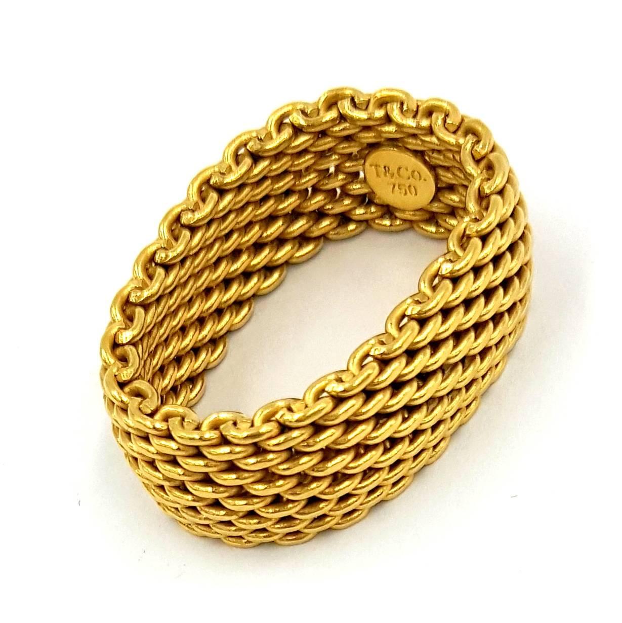 18K Yellow Gold Tiffany & Co. Somerset Exclusive Collection ring complete with signature stacked mesh links. Casual, refined, modern, elegant and most of all comfortable this ring is one of Tiffany's most popular pieces. This style was sold in two