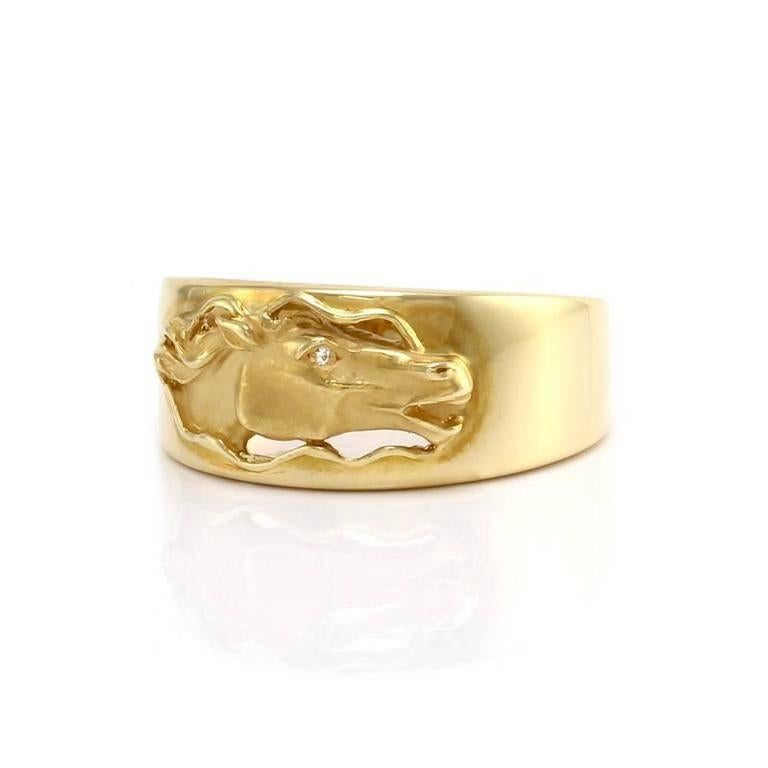 This Carrera y Carrera 18kt Galloping Horse Head  with diamond eye band ring is nothing more than fabulous. Made especially for the true horse and equestrian enthusiast. The horse head features one round brilliant cut diamond (0.005ct) as an accent