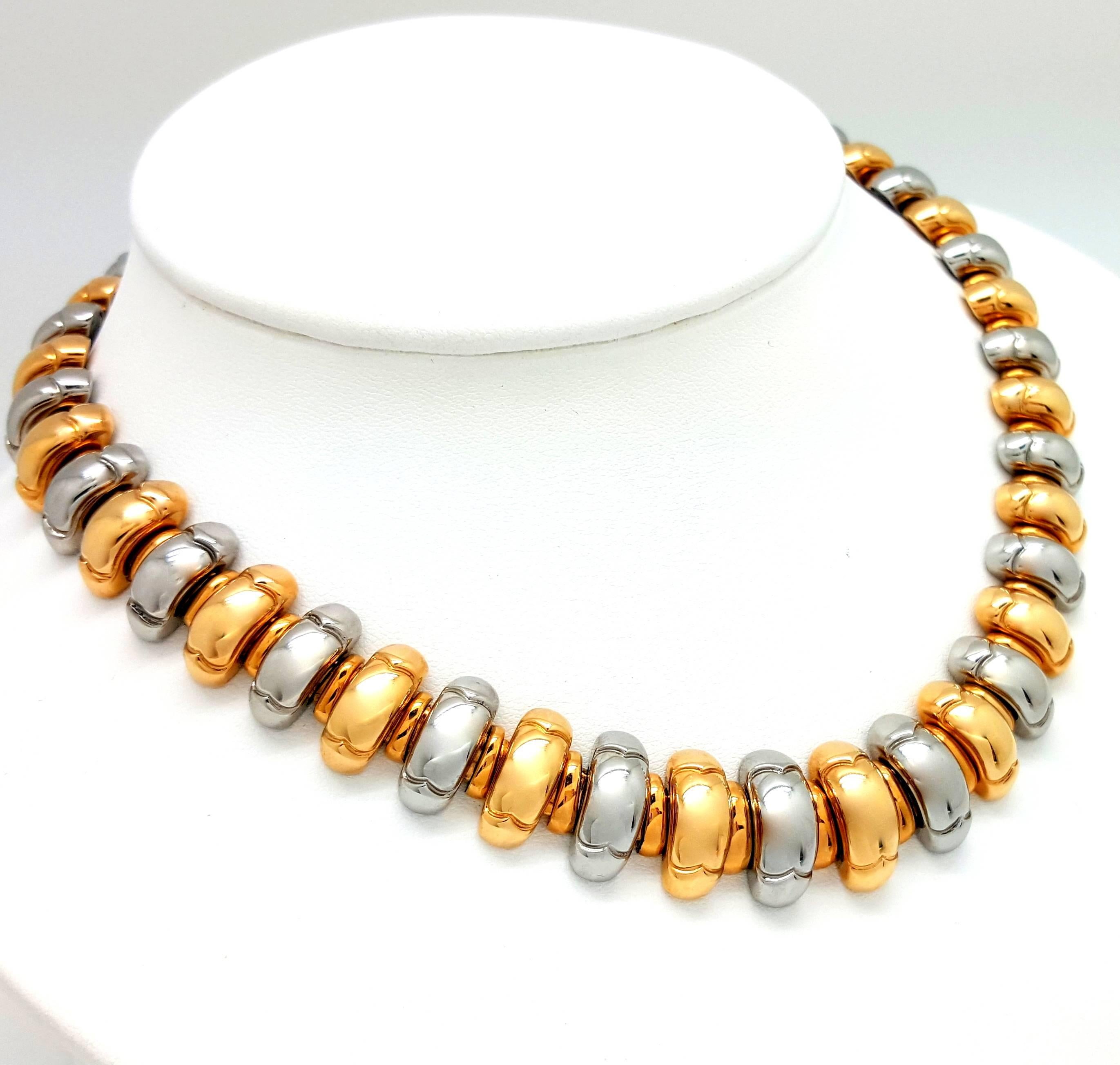 This heavy-weight Bvlgari necklace is made in solid 18k white gold and 18k yellow gold links. The links measure 17mm wide, and the necklace measures 15.5 inches long. The necklace weighs 113.87 grams.