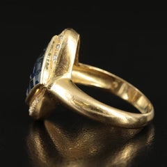18K Gold Invisible Set Sapphire and 0.10 CTW Diamond Navette Ring