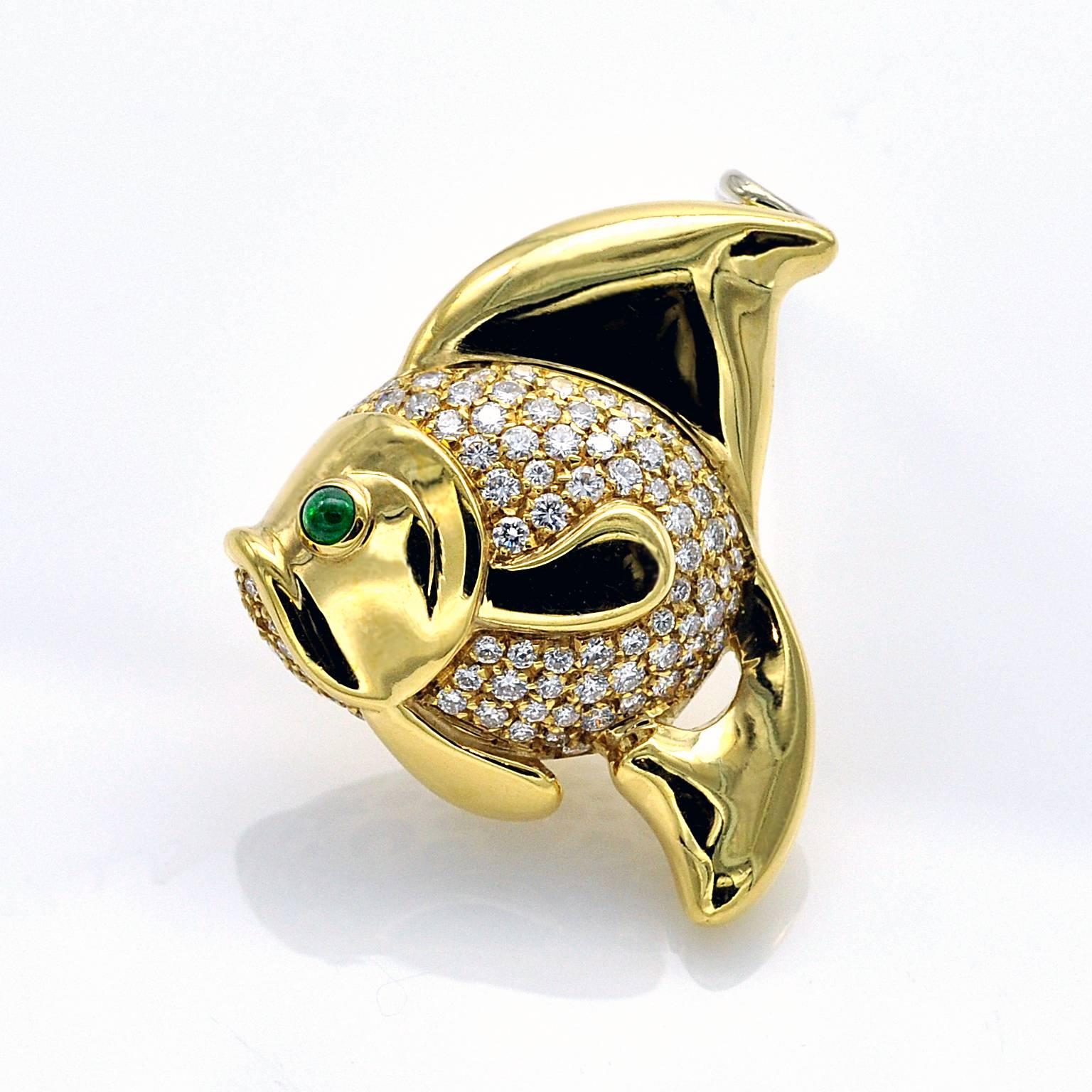 Exquisite  brooch - necklace !  the Fish is nice and rounded and ... so precious

The brooch is 18 kt gold, the body of the fish is pave set with high quality diamonds, with a round emerald cabochon for the eye. 

French state hallmark 