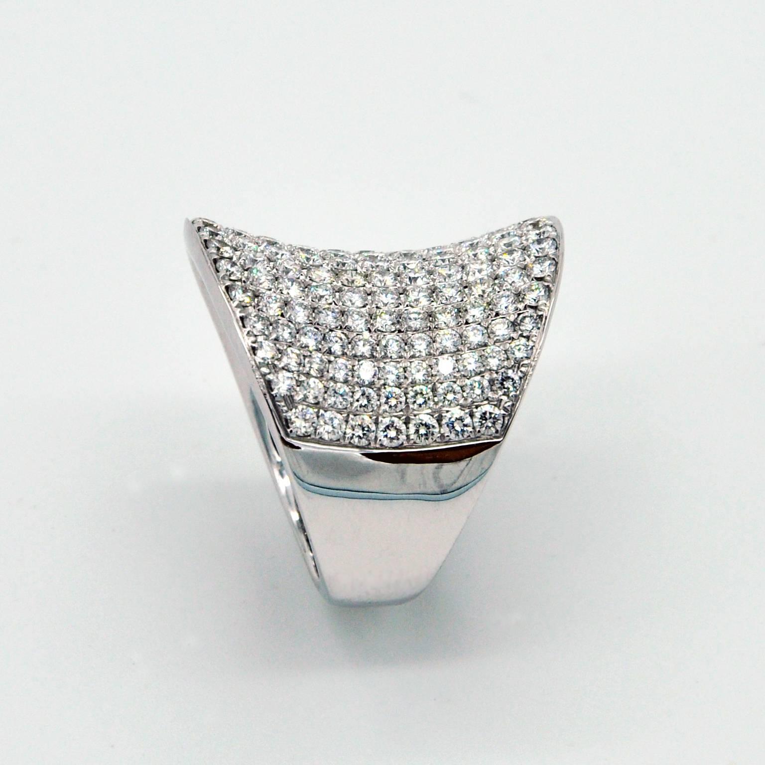 This elegant concave pave set ring is 2.3cm wide (0.9 in). Diamonds are G color and the craftsmanship exquisite.
Details:
Diamonds: 3,55 carats
