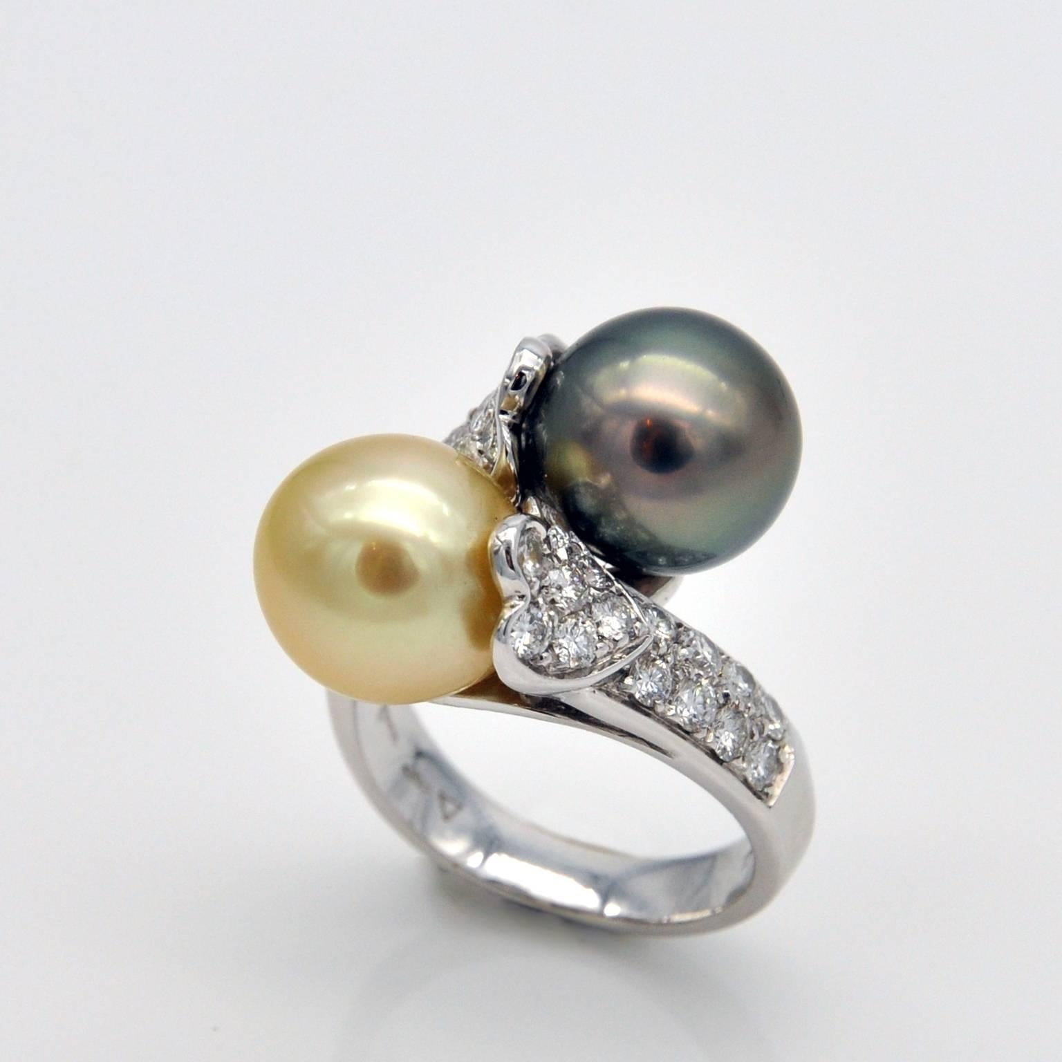 A grey Tahitian pearl and a light golden south sea pearl, set in an elegant 
