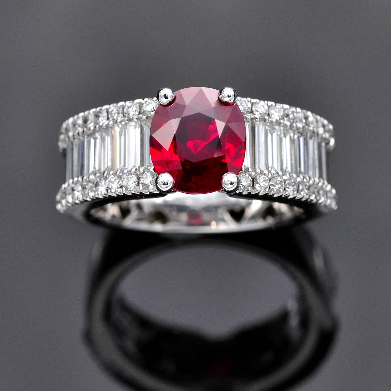 A Pigeon-Blood Ruby weighing 2.36 carats set on a sublime baguette and round diamond ring.

The ruby comes with a GRS certificate stating that it is a Burma ruby , Pigeon blood color and heat enhanced ( natural stone)  . The 1.41 carat diamonds are