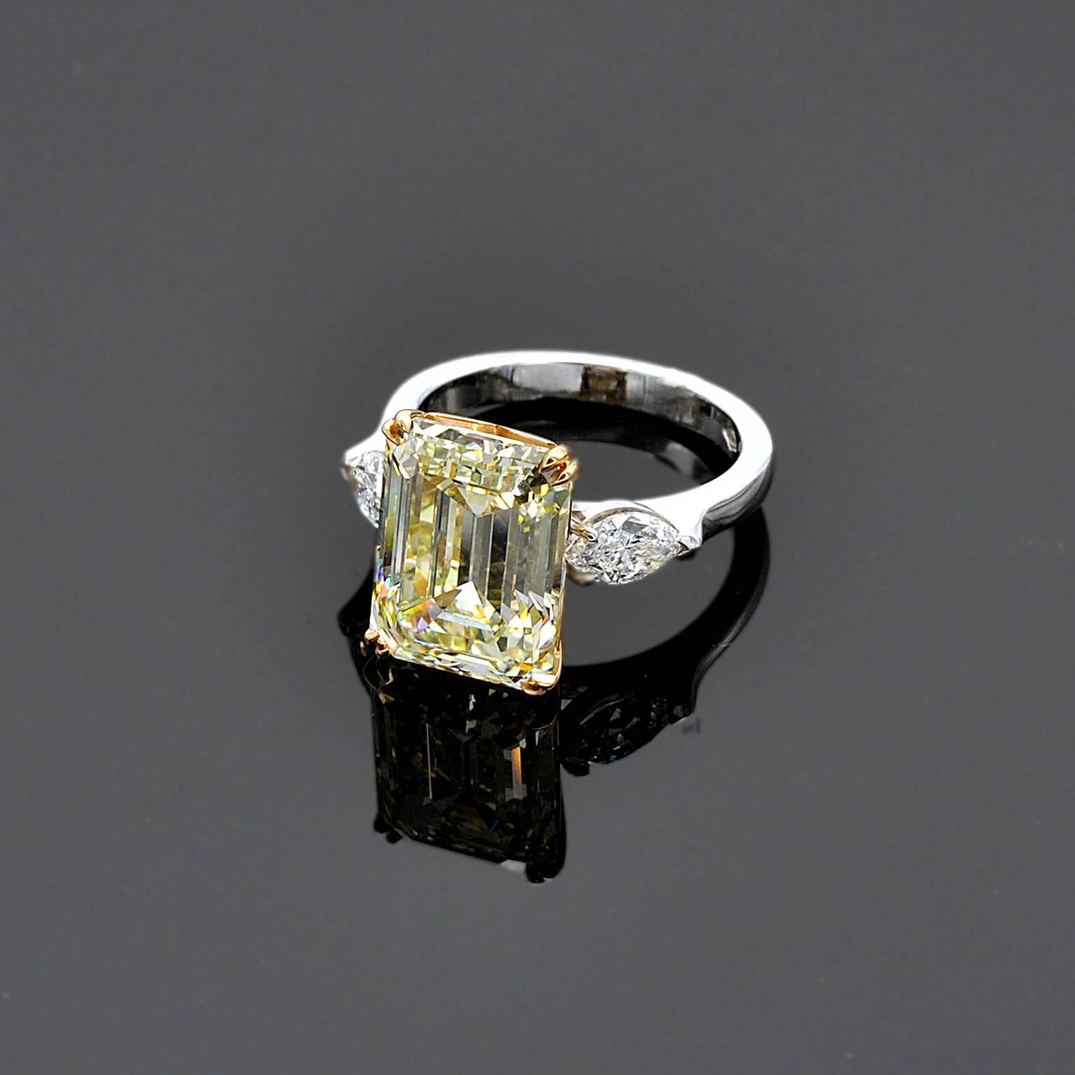 Outstanding solitaire ring. Fancy colored diamond are usually cut in radiant, oval or cushion shape.  Emerald cut is probably the more elegant cut possible. but it is also very rare in fancy color and thus  difficult to find.

Center diamond: 7,66