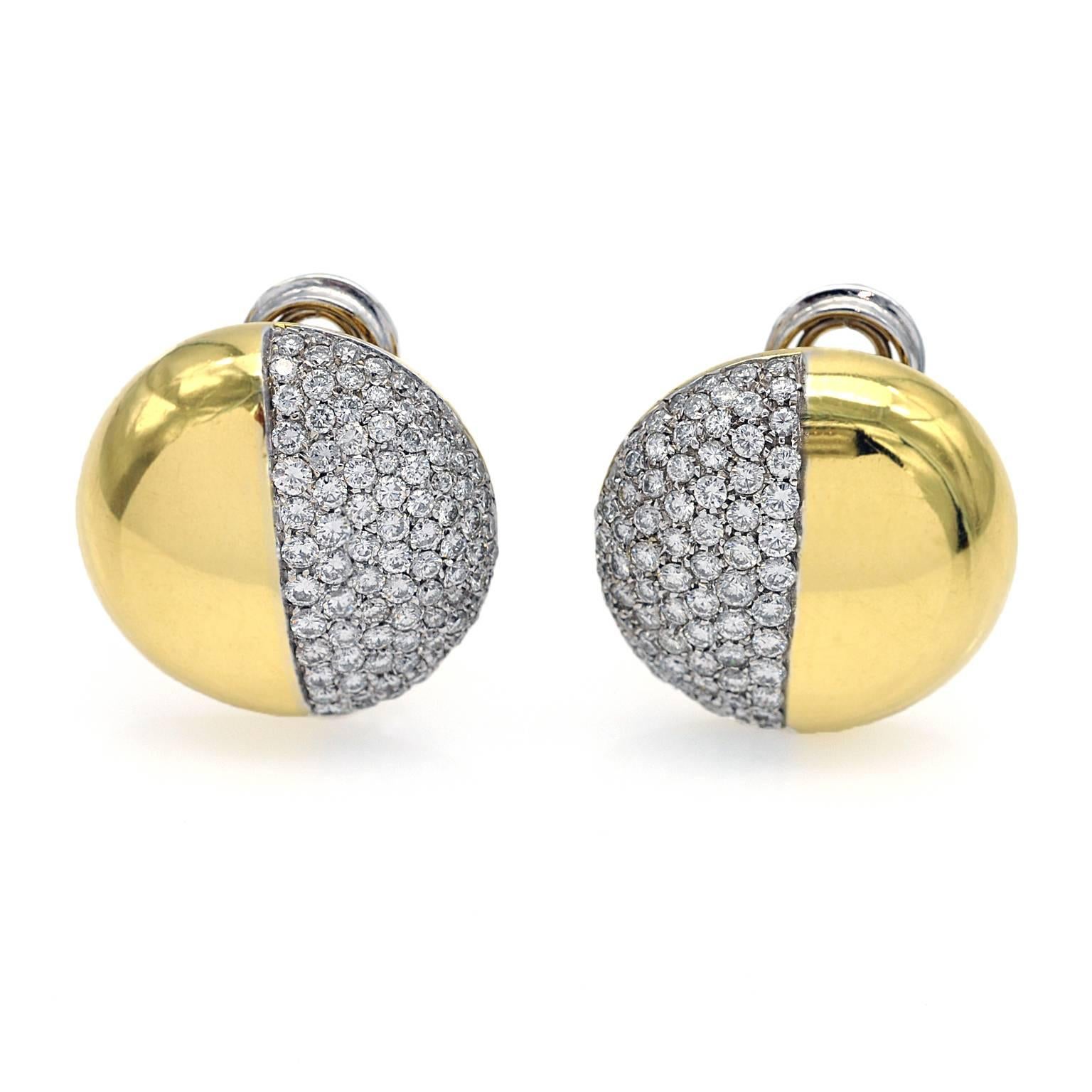 The perfectly simple and modern design of these clip-on earrings makes them both chic and easy to wear. 
these round earrings are slightly domed, one half shiny yellow gold, one half white gold  tightly pavé-set with diamonds (approximately 3