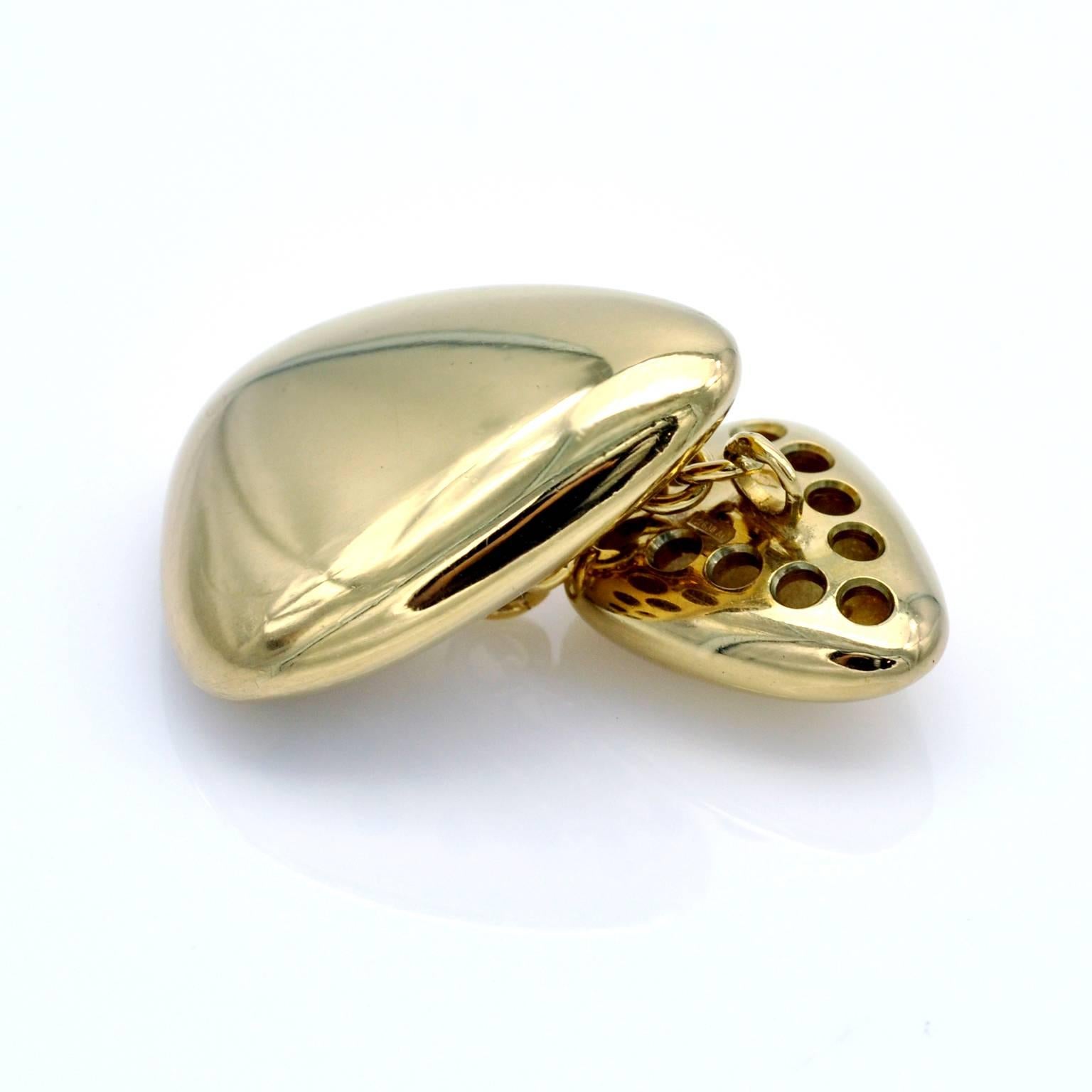 Modernist triangular rounded cufflinks in 18kt gold. they have a pleasant heft as well as eye catching look.