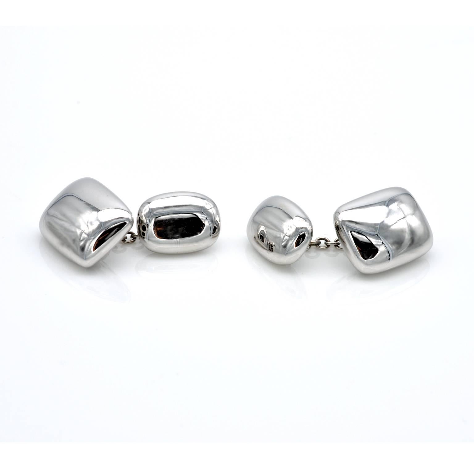 Modernist rectangular cushion saped cufflinks in 18kt white gold. they have a pleasant heft as well as eye catching look.
