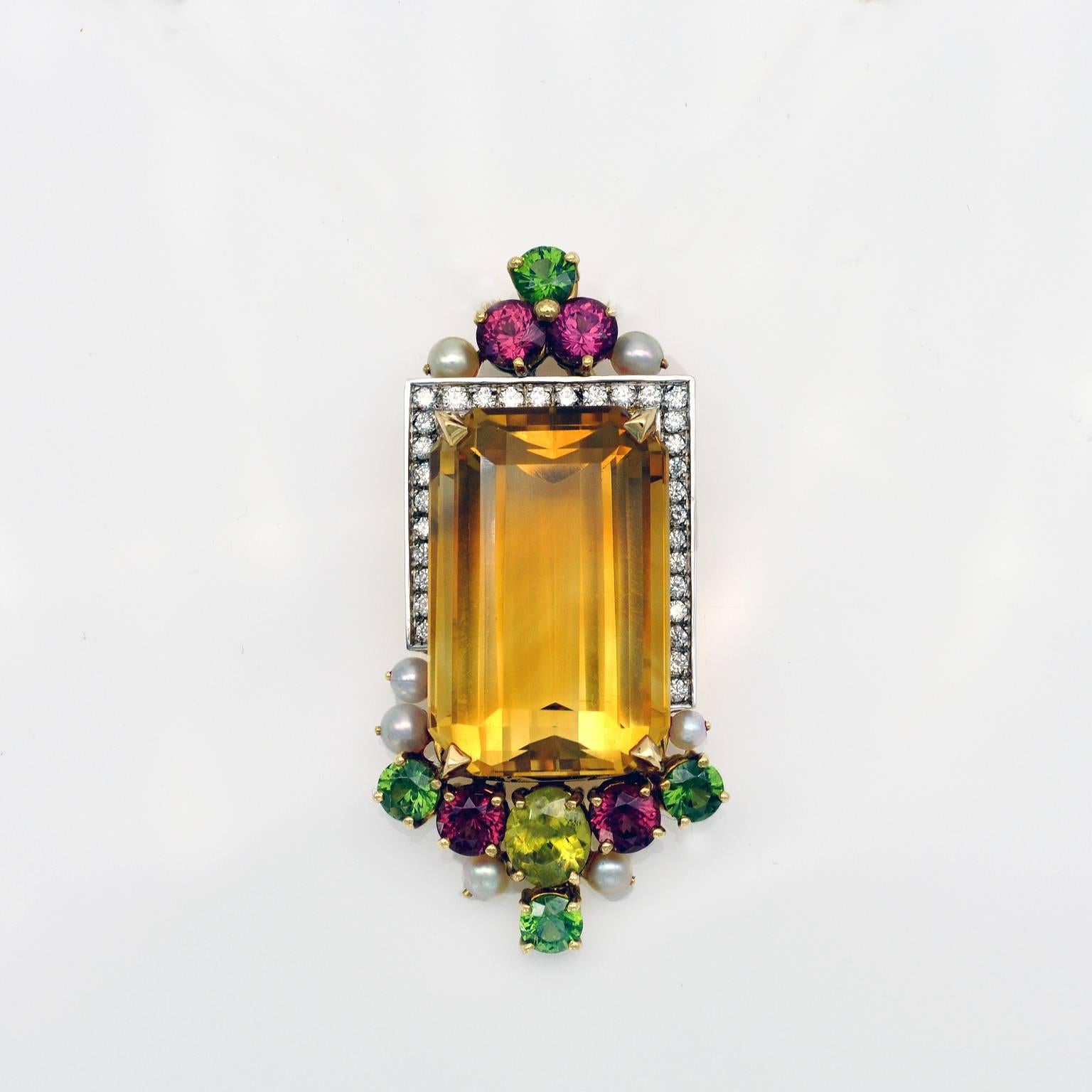 One of a kind Pendant. A truly striking composition in which the the colors of the stones complement each other. To richly colored citrine (34,4 carats) respond the warm purple of the Rhodolites the adamant green of the  Natural Zircon and the fiery