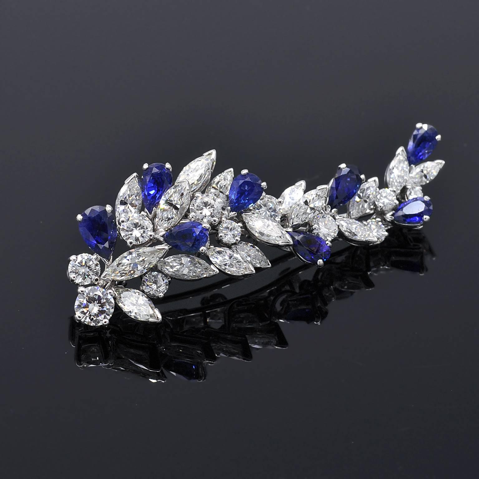 Elegant brooch by Missiaglia a famous italian (venice) jeweler since 1846.
It consists of a cluster of top quality diamonds and sapphires gracefully disposed. 

Diamonds :
round and marquise cut: approx. 7,5 carat E to G - VVS - VS
Sapphires: