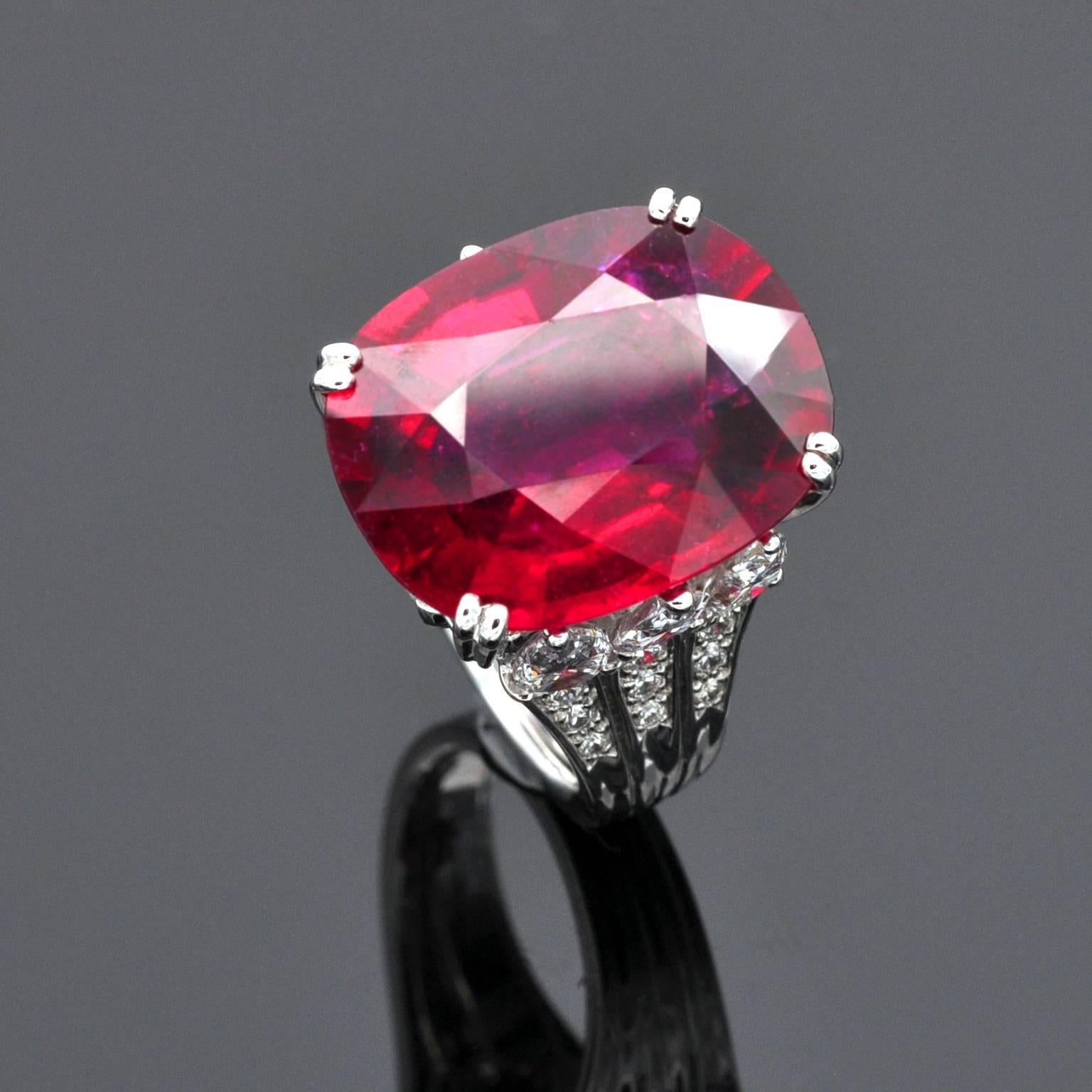 One of a kind  ring. The impressive Rubelite is set in an outstanding ring: Three pear shaped diamonds set with the point up on each side, two marquises  and 18 round brilliants give life to this unique piece of jewelry.
The Egyptian symbolic was an