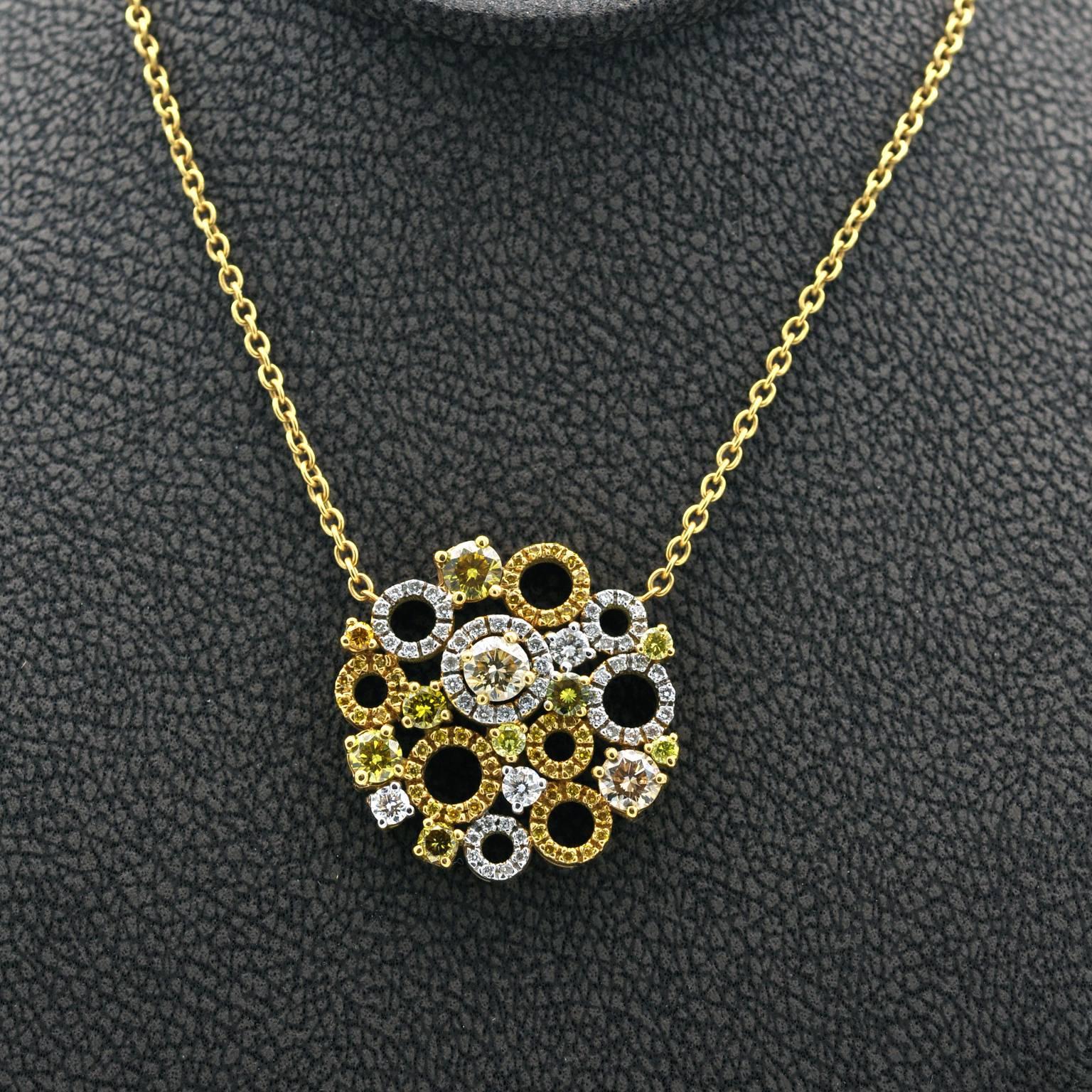 Attractive trendy Necklace, diamond set circles and round diamonds arranged in an elegant round bouquet like cluster.  
Yellow diamonds: 1.33 carat
white diamonds: 0.41 carat
