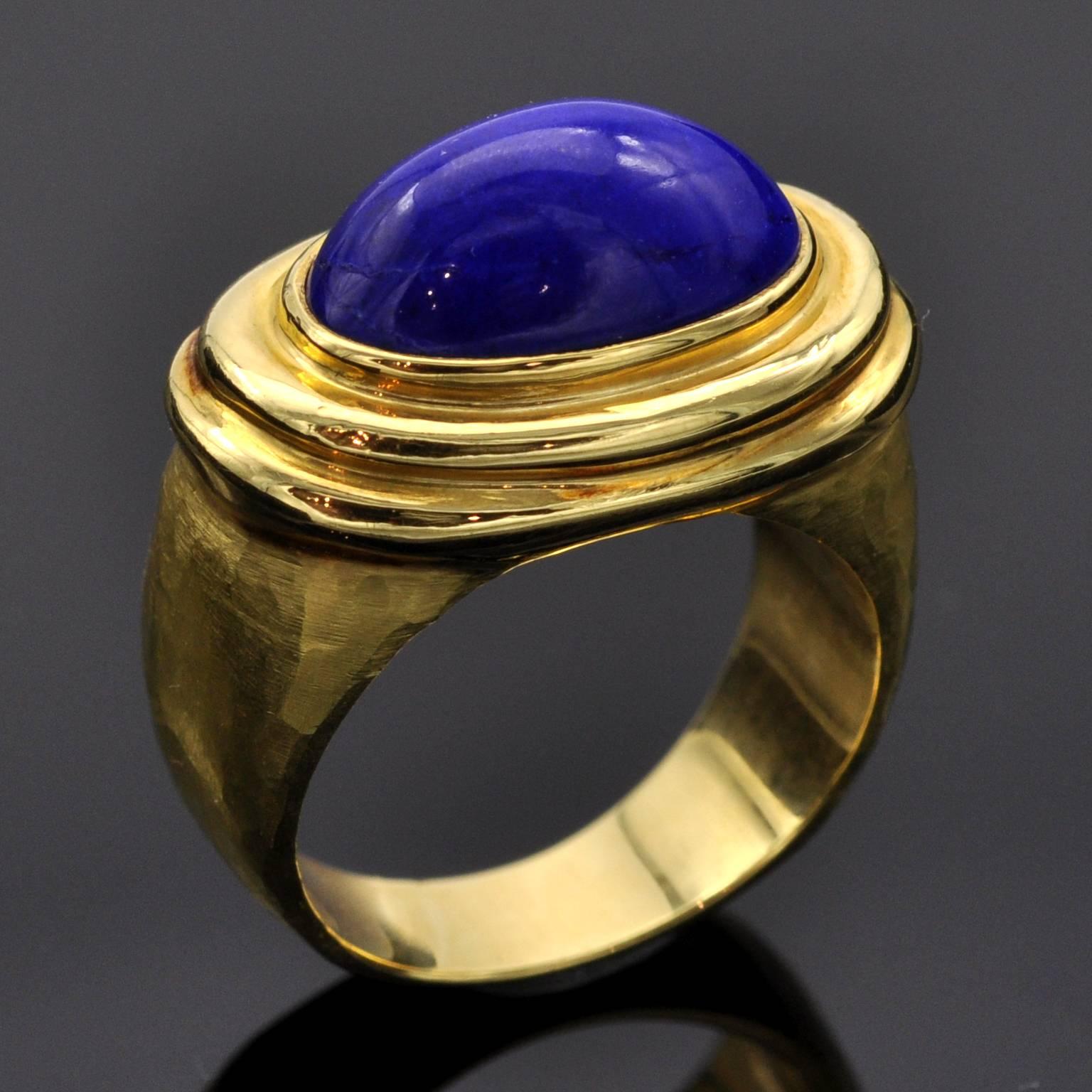 Hammered and polished 18kt gold with a bezel set top quality vivid blue lapis lazuli . This ring has definitely a simple yet strong design.

Matching Earrings are available ref LU47232798673