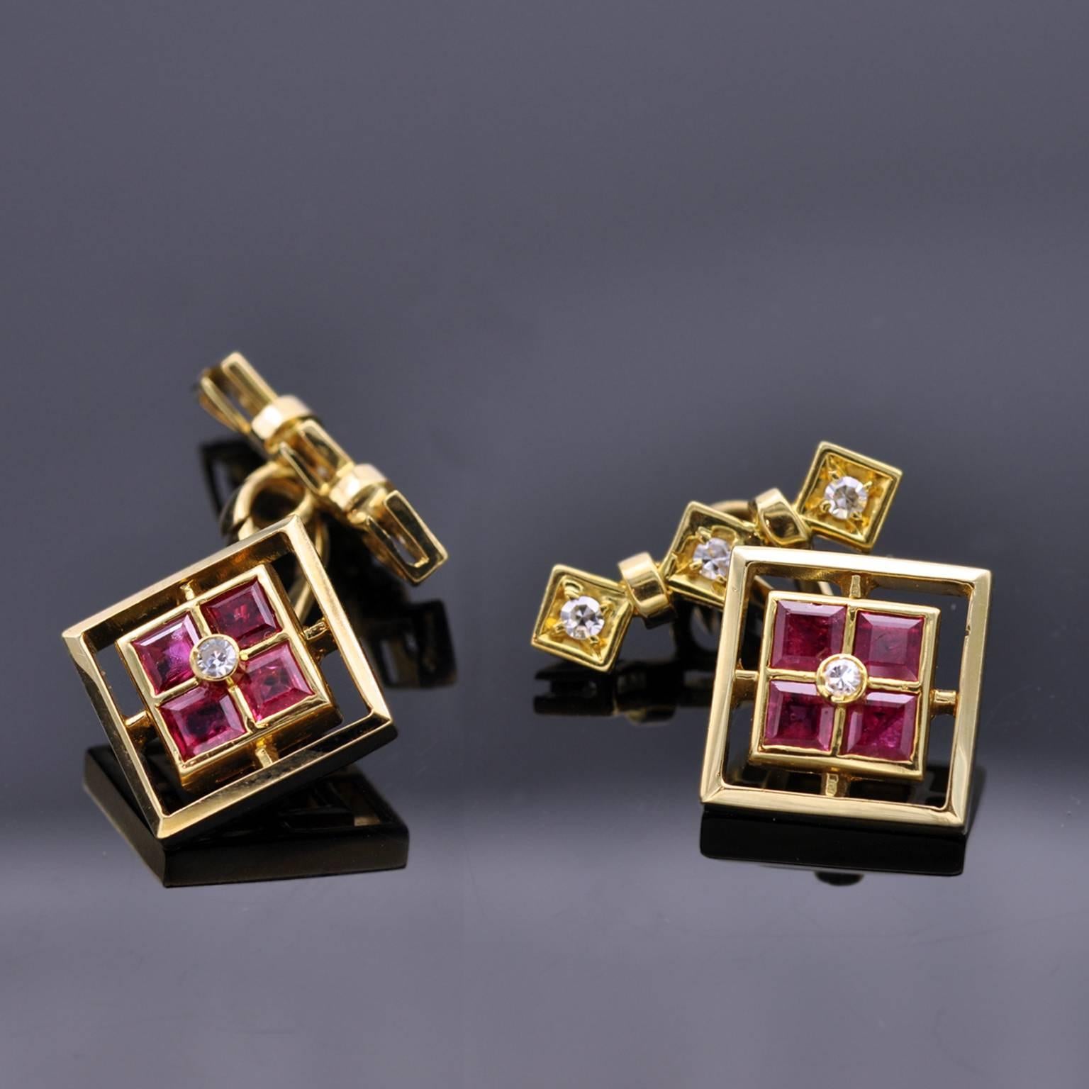 Four square rubies with a diamond nested in their midst in a square classy design. On the back to hold the cufflink in place three diamonds are set in three squares. excellent work. 
french hallmark