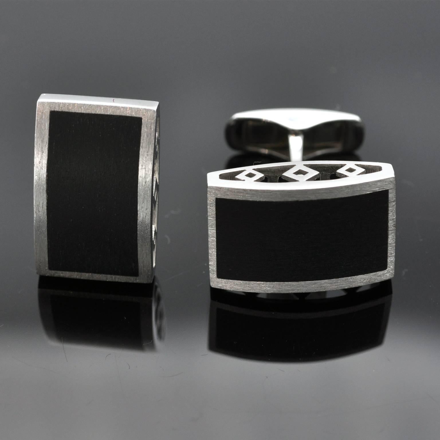 Modern cufflinks  . Rectangular onyx perfectly fitted in 18 kt white gold . the surface is curved and textured. Very pure design indeed.
French hallmark stamp