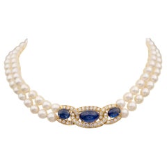 Perlenkette aus 18-karätigem Gelbgold mit Diamant- und Saphir-Cabochons