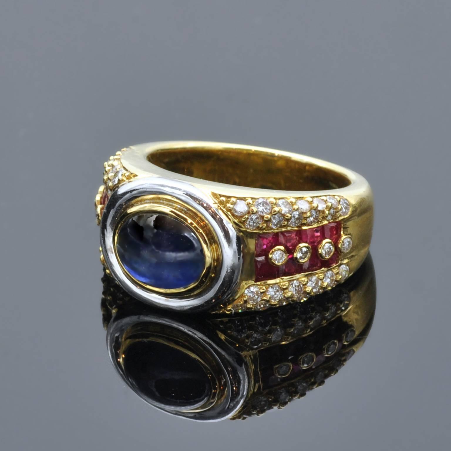 Impressive ring : in it center, a cabochon sapphire circled in white and yellow gold. On the yellow gold body of the ring square rubies and white diamonds.It is a well made ring and has a nice heavy feel in hand.