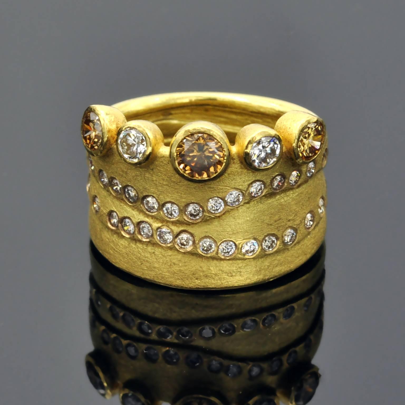 One of a kind modernist ring with ethnic inspiration. Champagne, brown and white diamonds are artistically combined to make this striking yet easy to wear ring. 

Michael Zobel is considered one of the most influential artist in the jewellery world.