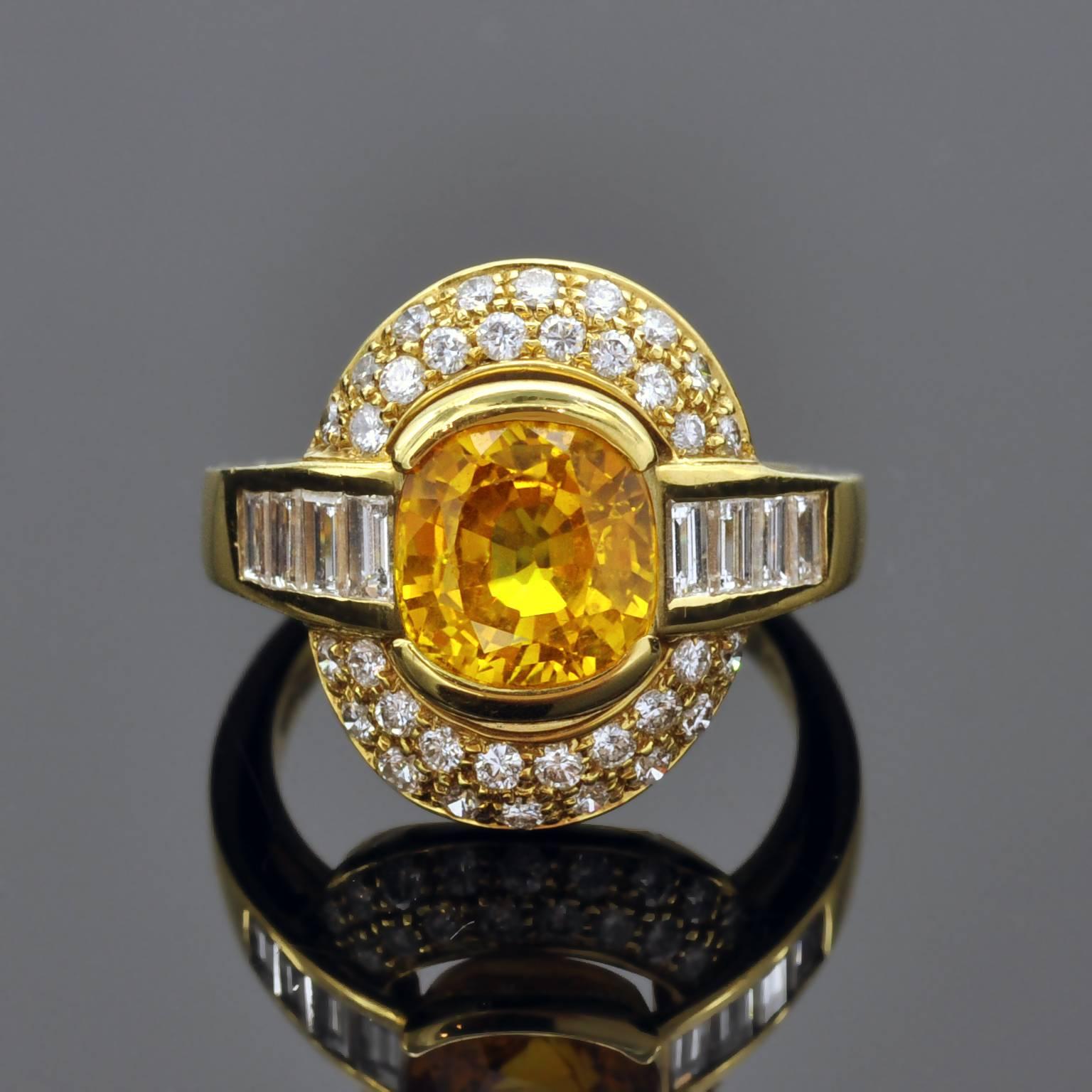 Elegant ring ,  vivid yellow sapphire weighing 2.18 carat surrounded by 1,54 carat of white diamonds round brilliant cut and baguette cut ( G VS + ) . You can see from the back the high quality of work. 