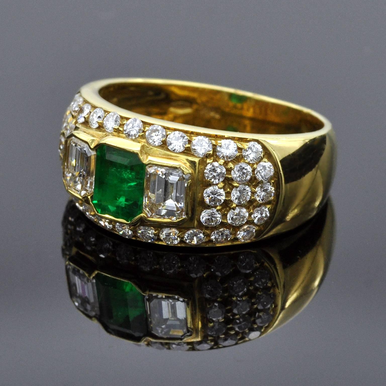 It is a three stone ring in a pave-set band. The center a 0.67 carat emerald is flanked with two emerald cut diamonds . Around this cluster 40 brilliant cut diamond are tightly set giving more light to the whole piece
Item details: 
Two emerald cut