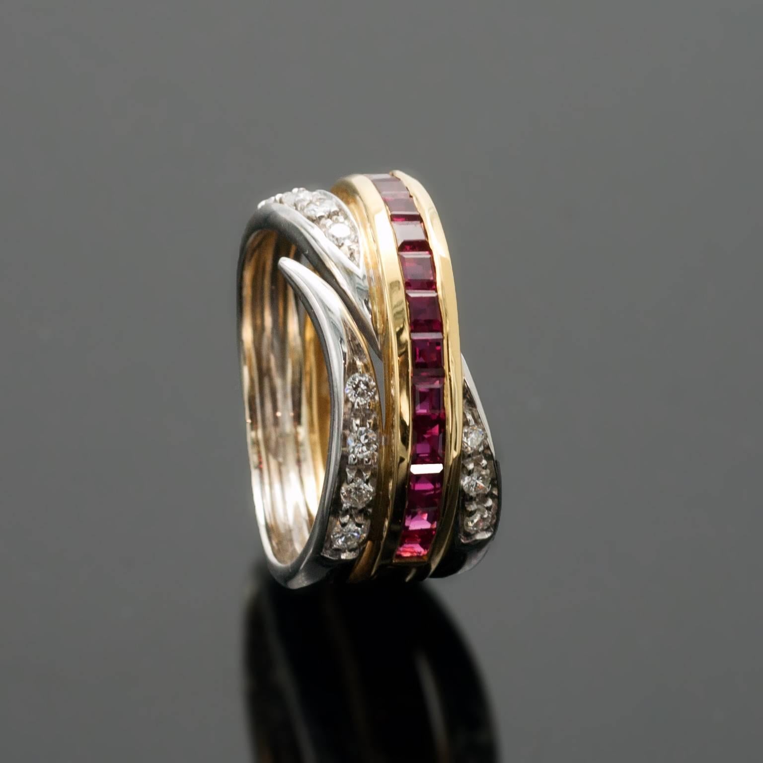 This band ring gracefully wraps around the finger. A line of square rubies are set in yellow gold while round brilliant cut diamonds  are set in 18KT white gold.

Total diamond weight approx: 0.25 ctw
Total Ruby weight approx: 1.25 ctw