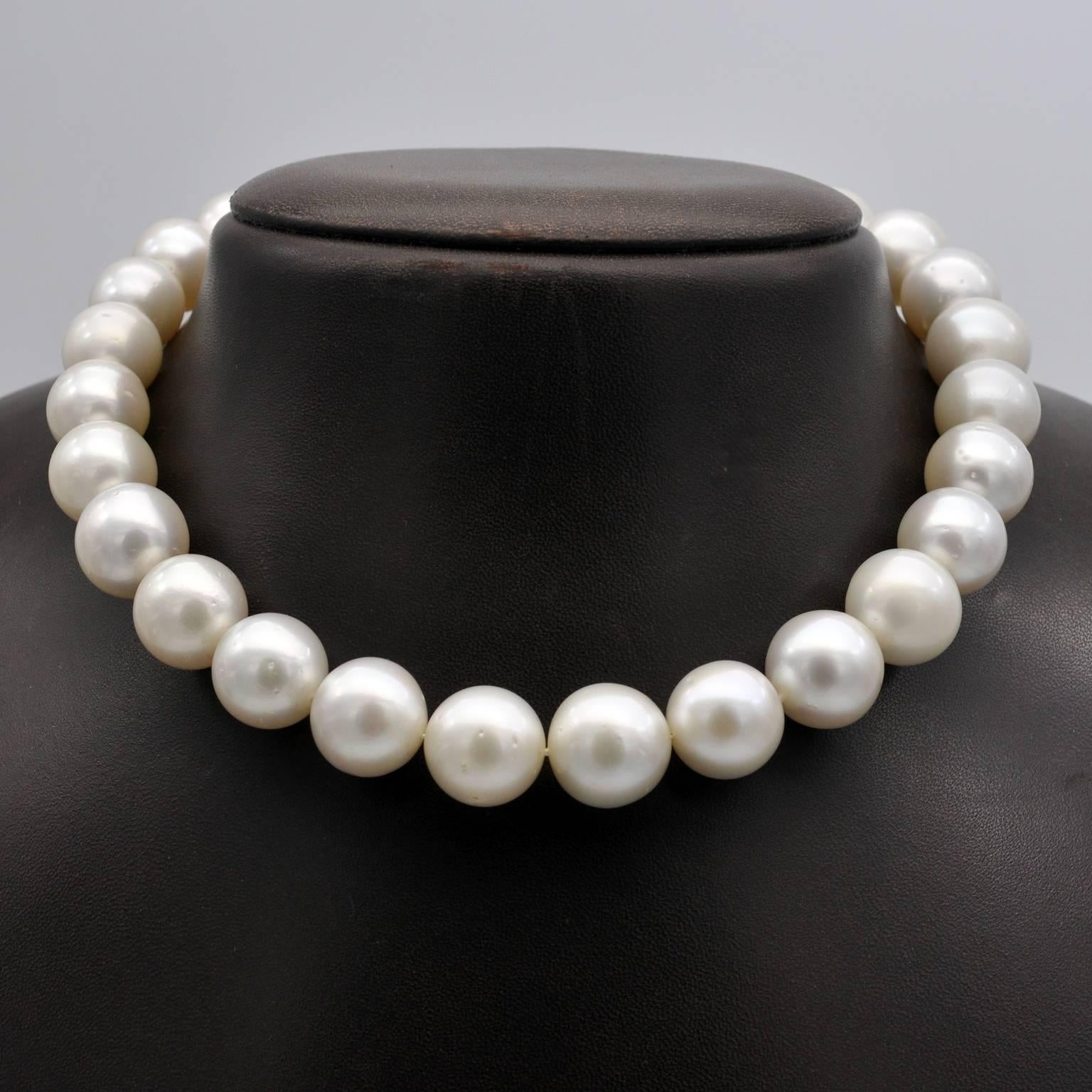 Elegant choker with 29 Large round white South Sea pearls graduated from 13.5mm to 17mm (which is quite an exceptional size) ! the pearls are hand-knotted. The clasp is invisible( hidden in a pearl)  an is detachable it is possible to make different