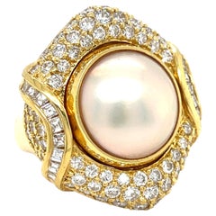 Mabe Pearl and Diamond Ring weight: 2.75 carats Mounted in 18k Gold Size: 5 1/4