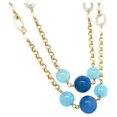 Collana in oro giallo 18k con calcedonio tinto e perle coltivate 42"