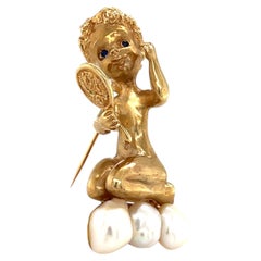 Spilla Ruser in oro 14k, modello "Monday's Child", con perla del fiume Mississippi e zaffiro