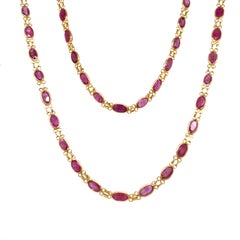 Collier en or jaune 14 carats avec un rubis ovale serti en lunette, 26"