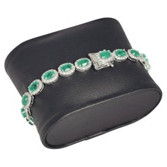 Platinum Tennis Bracelet with 8.52ct Emeralds and 2.60ct Diamonds