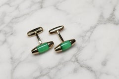 Gemelos de Salvatore Ferragamo en oro rosa de 18 quilates con piedras preciosas verdes