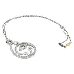 Collana Boodles con ciondolo a spirale traforato in oro bianco 18k con diamanti taglio a pera e rotondi