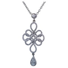 22311 Penny Preville: collana con ciondolo a nodo infinito in oro bianco 18 carati con pavé di diamanti