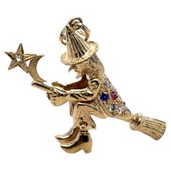 Vintage Articulated Gem-Set Witch on Broom Pendant in 9K Yellow Gold