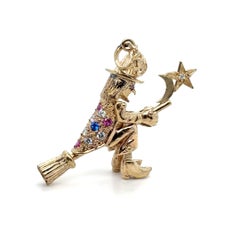 Vintage Articulated Gem-Set Witch on Broom Pendant in 9K Yellow Gold